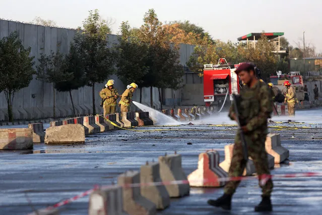 An Afghan soldier inspects the site of suicide attack In Kabul near Afghanistan's Defense Ministry, Monday, September 5, 2016.  Twin bombings near the Afghan Defense Ministry have killed dozens of people in an attack claimed by the Taliban. (Photo by Rahmat Gul/AP Photo)