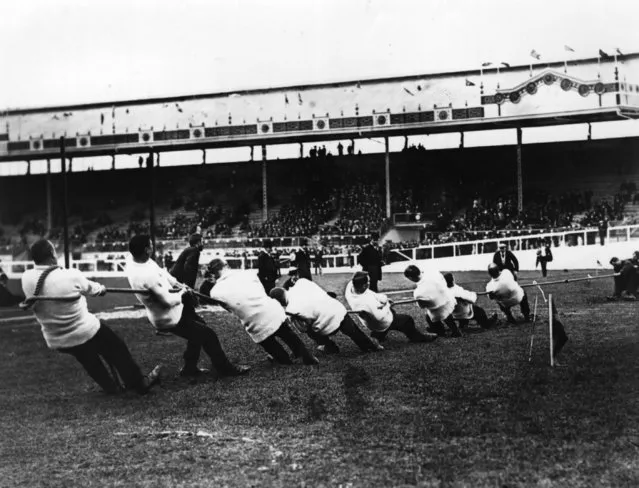 Great Britain (The Liverpool St Police tug-of-war team) taking on Ireland in the tug-of-war event at the 1908 London Olympics, July 1908. The Liverpool St Police tug-of-war team  beat the USA team and won the gold medal. William Hirons, Frederick Goodfellow, Edmond Barrett, James Shephard, Frederick Humphreys, Edwin Mills, Albert Ireton and Frederick Merriman. (Photo by Topical Press Agency/Getty Images)