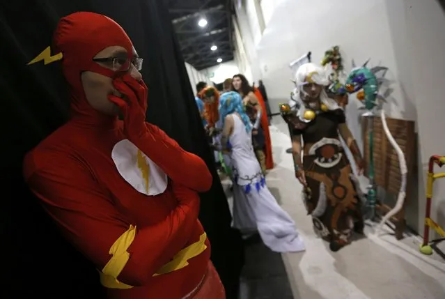 Participants dressed in superhero costumes wait backstage during the first edition of the HeroFestival in Marseille, November 9, 2014. (Photo by Jean-Paul Pelissier/Reuters)