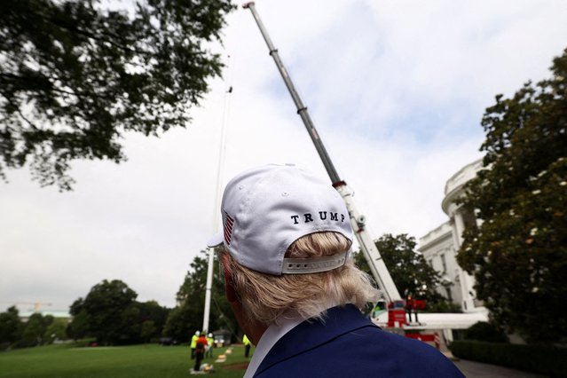 U.S. President Donald Trump looks on as workers install a new flagpole on the South Lawn at the White House in Washington on June 18, 2025. (Photo by Kevin Lamarque/Reuters)