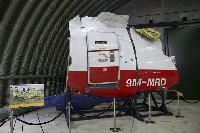 Wreckage of the MH17 airplane is seen after the presentation of the final report into the crash of July 2014 of Malaysia Airlines flight MH17 over Ukraine, in Gilze Rijen, the Netherlands, October 13, 2015. (Photo by Michael Kooren/Reuters)