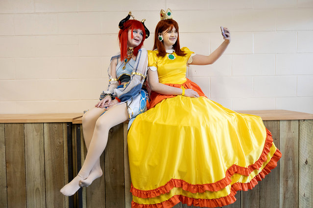 Lana, 13, cosplays as Genshin Impact’s Nilou while Vae, 15, appears as Princess Daisy from the Mario series at the annual Comi-Con event held in Exeter, Devon, UK on March 10, 2024. (Photo by Mark Passmore/APEX News)