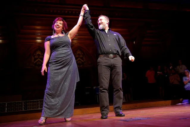 NASA scientists Lisa Danielson (L) and Will Stepanov are celebrated onstage for their wedding anniversary during the 26th First Annual Ig Nobel Prize ceremony at Harvard University in Cambridge, Massachusetts, U.S. September 22, 2016, fifteen years after they were married during an IgNobel prize ceremony. (Photo by Brian Snyder/Reuters)
