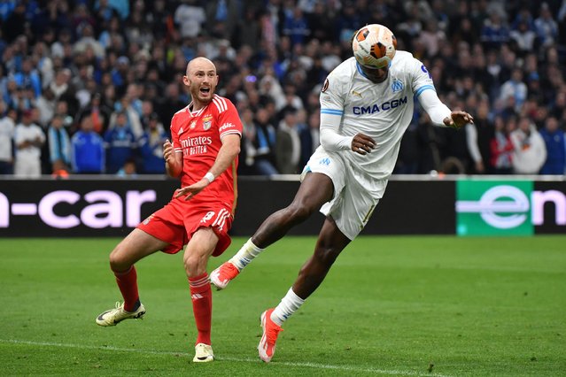 Marseille's Cameroonian forward #14 Faris Moumbagna (R) scores his team's first goal during the UEFA Europa League quarter final second leg football match between Olympique de Marseille (OM) and SL Benfica at the Stade Velodrome in Marseille on April 18, 2024. (Photo by Sylvain Thomas/AFP Photo)