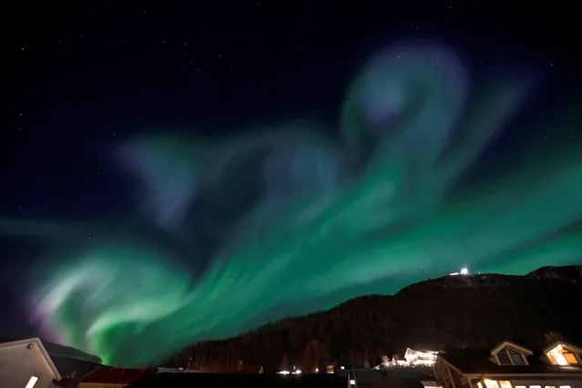 Northern lights are seen over Tromsoe, Norway on November 2, 2022. (Photo by Rune Stoltz Bertinussen/NTB via AFP Photo)