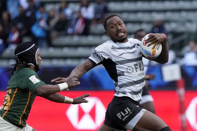 Fiji's Iowane Teba breaks away from South Africa's Jaiden Baron during a World Rugby Sevens Series quarterfinal match in Carson, Calif., Sunday, February 26, 2023. (Photo by Marcio Jose Sanchez/AP Photo)