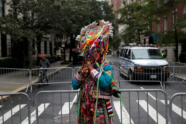 A man adjusts his hat while participating in the 52nd annual Hispanic Day Parade in Manhattan, New York, U.S., October 9, 2016. (Photo by Andrew Kelly/Reuters)