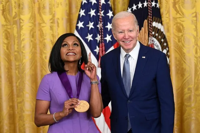 US President Joe Biden awards actress Mindy Kaling with the 2021 National Medal of Arts during a ceremony in the East Room of the White House in Washington, DC, March 21, 2023. (Photo by Saul Loeb/AFP Photo)