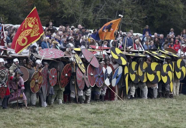 Re-enactors participate in a re-enactment of the Battle of Hastings, commemorating the 950th anniversary of the battle, in Battle, Britain October 15, 2016. (Photo by Neil Hall/Reuters)