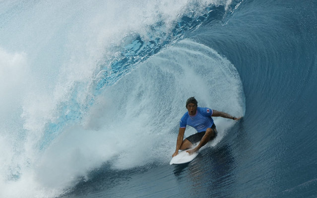 Japan's Kanoa Igarashi gets a barrel in the fifth heat of the men's surfing third round during the Paris Olympic Games in Teahupo'o off the French Polynesian Island of Tahiti, Monday, July 29, 2024. (Photo by Ben Thouard/Pool Photo via AP Photo