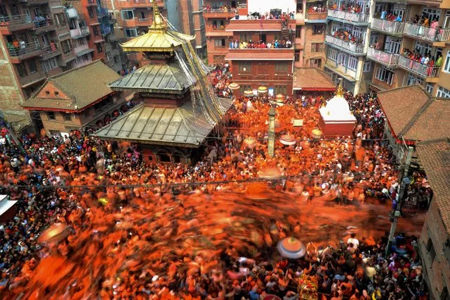 Revellers celebrate the Bisket Jatra Festival in Thimi in the Bhaktapur District on the outskirts of Kathmandu on April 15, 2023. (Photo by Prakash Mathema/AFP Photo)