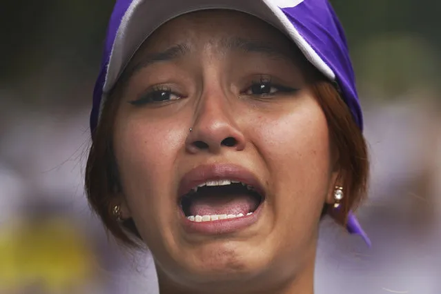 Vania Hernandez Portillo, whose mother is disappeared, joins the mothers of disappeared children marching to demand government help in the search for their missing loved ones on Mother's Day in Mexico City, Wednesday, May 10, 2023. (Photo by Marco Ugarte/AP Photo)