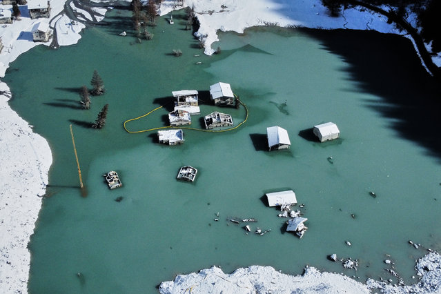 An aerial view shows the partly flooded village of Blatten after recent snowfalls, five months after a landslide destroyed the village, Blatten, Switzerland, on Tuesday, October 28, 2025. (Phoot by Michael Probst/AP Photo)