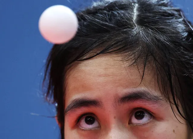 Thailand’s Suthasini Sawettabut keeps her eyes on the ball during the table tennis women’s singles final at the Southeast Asian Games in Cambodia on May 16, 2023. (Photo by Chalinee Thirasupa/Reuters)
