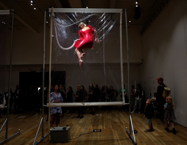 People view an interactive art installation titled “Shrink 01995”, by the Belgian artist Lawrence Malstaf, at the Hancock Museum in Newcastle, Britain on August 8, 2024. (Photo by Lee Smith/Reuters)