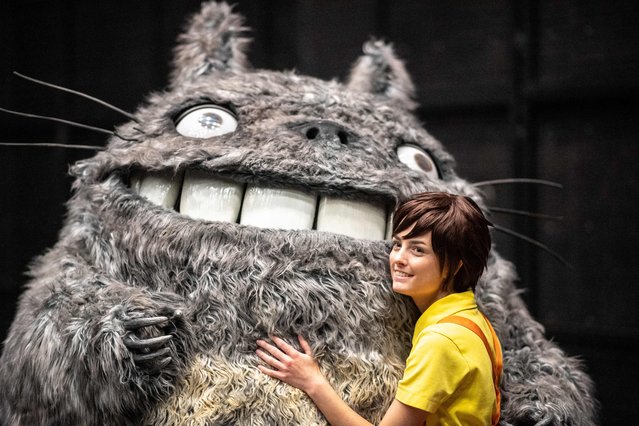 Sweden's Henrik Pilerud, inside the Totoro costume, and his team member Victoria Christensen (R) pose during an interview with AFP ahead of a rehearsal before the world cosplay championship 2024 during the World Cosplay Summit in Nagoya on August 3, 2024. (Photo by Philip Fong/AFP Photo)