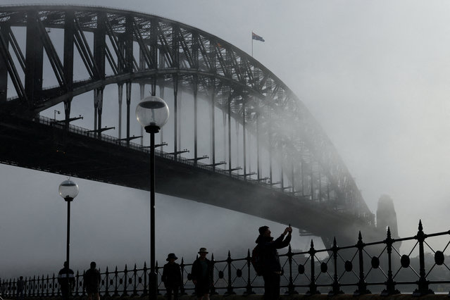 Fog is seen over Sydney Harbour Bridge in Sydney, Australia on June 2, 2025. (Photo by Hollie Adams/Reuters)