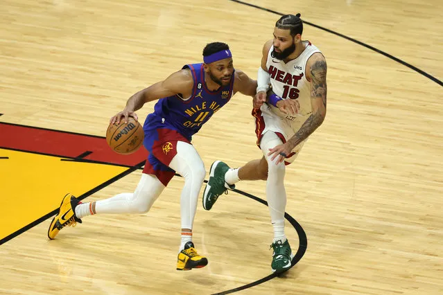 Bruce Brown #11 of the Denver Nuggets dribbles against Caleb Martin #16 of the Miami Heat during the fourth quarter in Game Three of the 2023 NBA Finals at Kaseya Center on June 07, 2023 in Miami, Florida. (Photo by Megan Briggs/Getty Images)