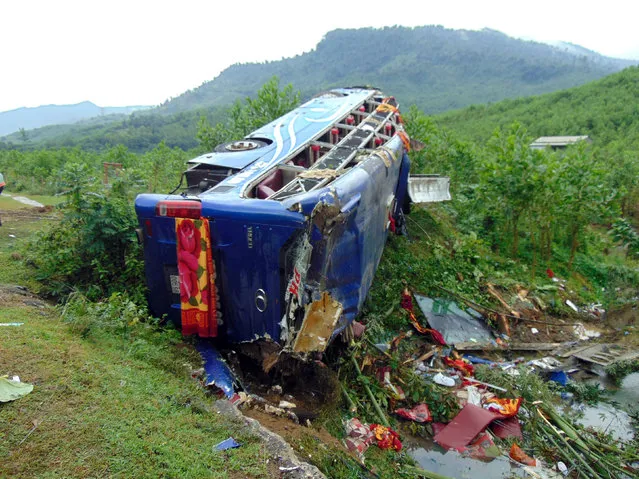 The wreckage of a bus is seen at its crash site at Quang Nam province in Vietnam, November 9, 2016. (Photo by Reuters/Vietnam News Agency)