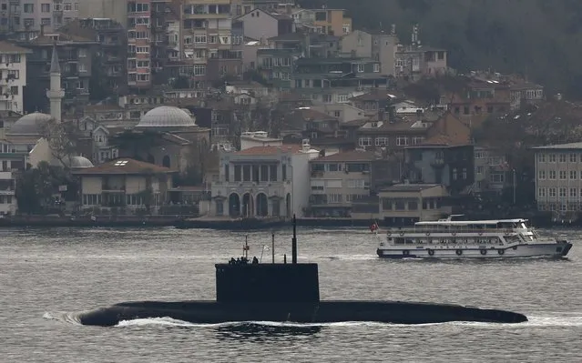 Russia's diesel-electric submarine Rostov-on-Don sets sail in the Bosphorus, on its way to the Black Sea, in Istanbul, Turkey, December 13, 2015. (Photo by Murad Sezer/Reuters)