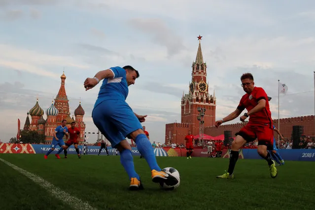 Players take part in a soccer match between the Millennium United amateur soccer team and a team of film and theatre actors in the World Cup Football Park in Red Square in central Moscow, Russia June 29, 2018. (Photo by Maxim Shemetov/Reuters)