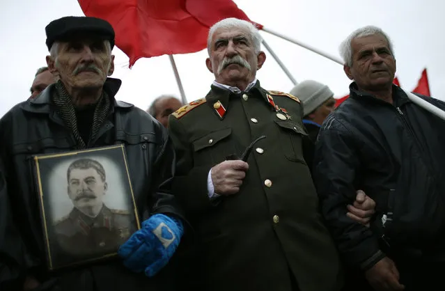 Zaur Tsurtsumia (C), 78, dressed as Soviet leader Joseph Stalin during a rally marking Stalin's birthday anniversary at his hometown of Gori, Georgia, December 21, 2015. (Photo by David Mdzinarishvili/Reuters)