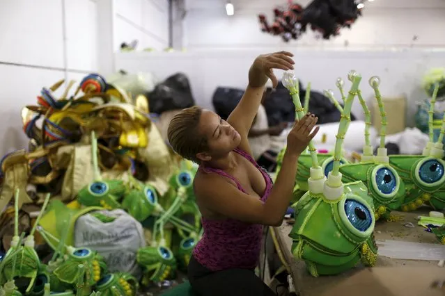 A worker prepares a carnival costume at the Mocidade Independente Samba school in preparation for the annual carnival parade, in Rio de Janeiro, Brazil, January 7, 2016. The Rio de Janeiro Carnival will be held from February 5 to February 9. (Photo by Pilar Olivares/Reuters)