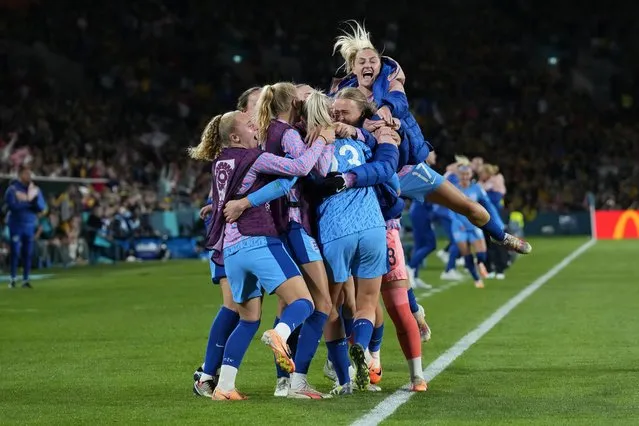 England's team players celebrate after Alessia Russo scored her side's third goal during the Women's World Cup semifinal soccer match between Australia and England at Stadium Australia in Sydney, Australia, Wednesday, August 16, 2023. (Photo by Abbie Parr/AP Photo)