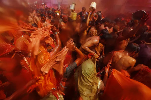 Women beat men with torn clothes during “Huranga” at Dauji temple, near the northern Indian city of Mathura, March 7, 2015. (Photo by Adnan Abidi/Reuters)
