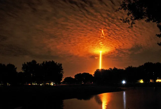 SpaceX Falcon 9 launches from Cape Canaveral, as seen from Woodside park in Viera, Fla., Monday, July 18, 2016. (Photo by Tim Shortt/Florida Today via AP Photo)