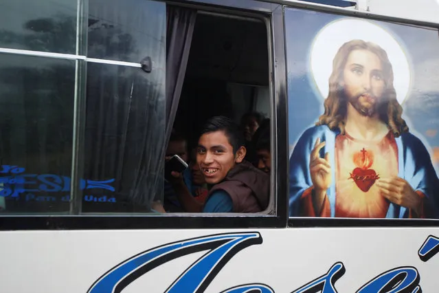 A passenger inside a bus smiles in Agua Caliente on the border between Honduras and Guatemala, in Ocotepeque municipality, Honduras, December 22, 2016. (Photo by Jorge Cabrera/Reuters)