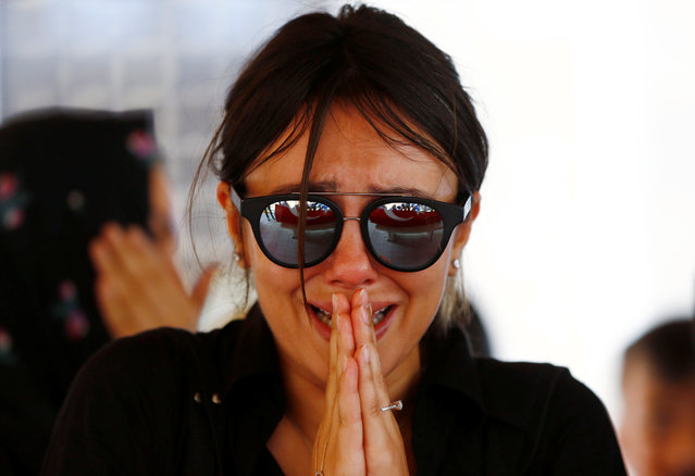A friend of Gulsen Bahadir, a victim of Tuesday's attack on Ataturk airport, mourns during her funeral ceremony in Istanbul, Turkey, June 29, 2016. (Photo by Osman Orsal/Reuters)