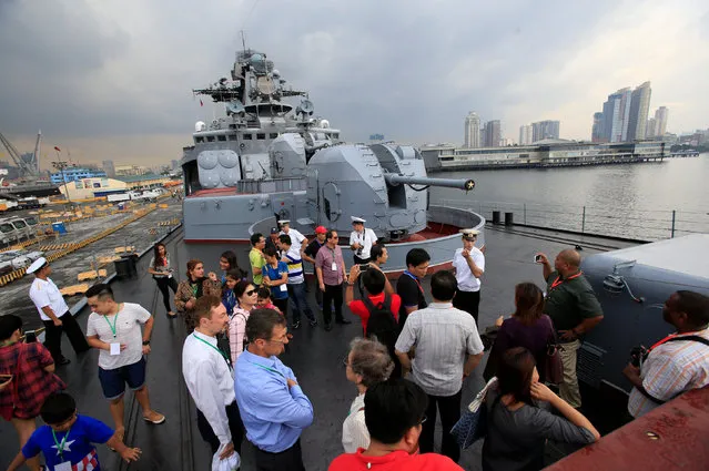 Members of the Russian Navy show to visitors the features of the Admiral Tributs, a large anti-submarine vessel, during a public tour of the vessel docked at the South Harbor, Port Area, in Metro Manila, Philippines January 5, 2017. (Photo by Romeo Ranoco/Reuters)
