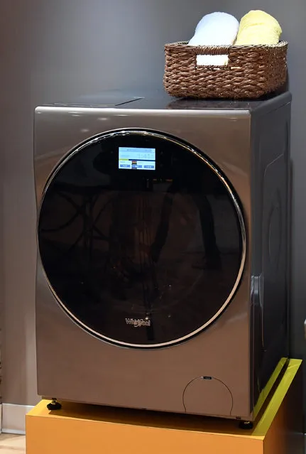 Whirlpool's All-In-One Washer and Dryer Combo is displayed at CES 2017 at the Sands Expo and Convention Center on January 5, 2017 in Las Vegas, Nevada. The USD 1,499 unit will be available at the end of this year and does not require the user to transfer clothes from a washer to a separate dryer and automatically dispenses the correct amount of detergent based on each load. (Photo by Ethan Miller/Getty Images)