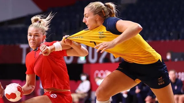 Sweden's pivot Linn Blohm is challenged by Norway's left back Veronica Kristiansen during the women's bronze medal handball match between Norway and Sweden of the Tokyo 2020 Olympic Games at the Yoyogi National Stadium in Tokyo on August 8, 2021. (Photo by Siphiwe Sibeko/Reuters)