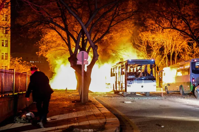 Turkish army service busses burn after an explosion on February 17, 2016 in Ankara, Turkey. 21 people are believed to have been killed and at least 61 are said to be wounded according to the city's governor Mehmet Kiliclar in what appeared to have been a car bomb attack on a vehicle carrying military personnel in the Turkish capital. (Photo by Defne Karadeniz/Getty Images)