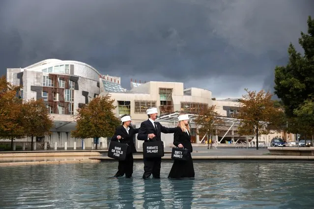 Members of Ocean Rebellion protest against salmon farming outside the Scottish Parliament in Edinburgh, Scotland, Britain on October 7, 2022. (Photo by Russell Cheyne/Reuters)