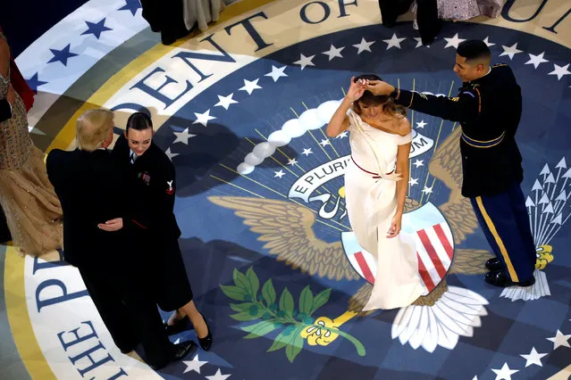 U.S. Army Staff Sergeant Jose Medina twirls first lady Melania Trump as she and U.S. President Donald Trump attend the Commander in Chief/Salute to Armed Forces Ball in honor of his inauguration in Washington, U.S. January 20, 2017. (Photo by Jonathan Ernst/Reuters)