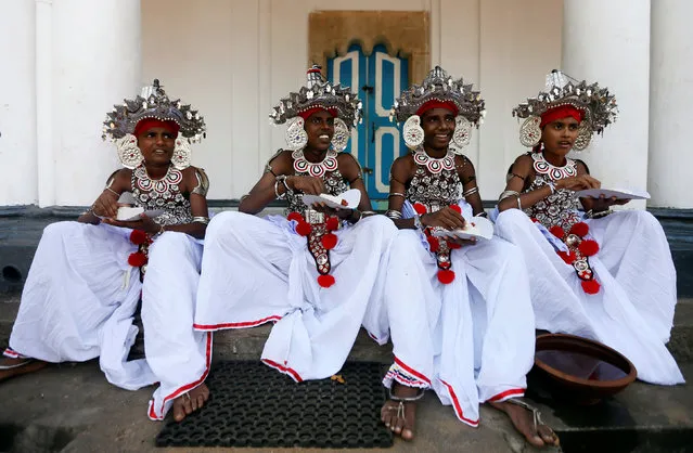 School boys who attend Sri Lankan traditional dance training share a moment during their graduation ceremony at a Buddhist temple in Colombo, Sri Lanka January 23, 2017. (Photo by Dinuka Liyanawatte/Reuters)