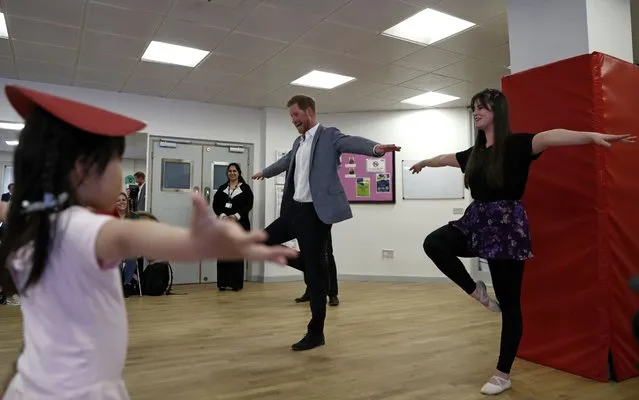 Britain's Prince Harry, Duke of Sussex (C) takes part in a ballet class for 4 to 6 year olds, while on a visit to YMCA South Ealing in west London on April 3, 2019, to learn more about their work on mental health and see how they are providing support to young people in the area YMCA South Ealing is part of “YMCA St Paul's Group”, which provides services across South West, South and East London, and is one of the largest YMCAs in Europe. (Photo by Adrian Dennis/AFP Photo)