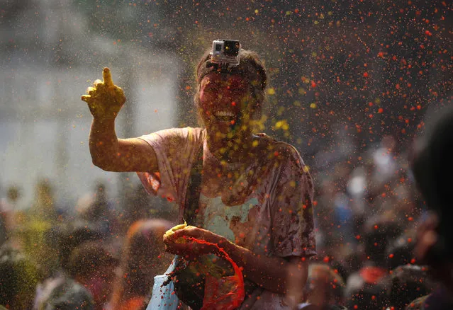 A woman celebrates Holi, the Festival of Colours, in Kathmandu, Nepal, March 22, 2016. (Photo by Navesh Chitrakar/Reuters)