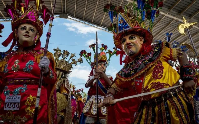 Residents dress up with colorful local version of Roman soldiers as they celebrate Easter Sunday on April 21, 2019 in Mogpog in Marinduque, Philippines. Christians worldwide celebrated Easter on Sunday, commemorating the day on which Jesus Christ is believed to have risen from the dead. Also known as Resurrection Sunday, Christians across the globe describe Easter in the New Testament having occurred on the third day of Jesus' burial after his crucifixion on Good Friday by the Romans at approximately 30 AD. (Photo by Jes Aznar/Getty Images)