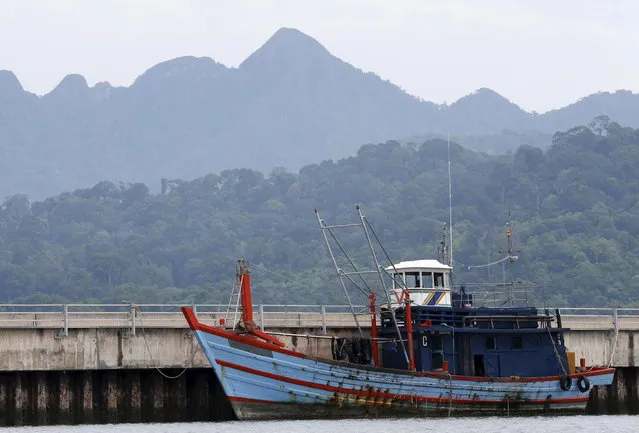 A boat that carried Rohingya migrants for three months is seen at Langkawi island, in the Malaysia's northern state of Kedah May 12, 2015. (Photo by Olivia Harris/Reuters)