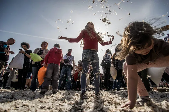 Young people participate in a pillow fight to mark the International Pillow Fight Day in the Heroes' Square in central Budapest, Hungary, 02 April 2016. (Photo by Zoltan Balogh/EPA)