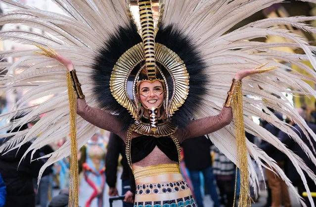 A woman dressed in carnival costume participates during the parade of the presentation act of the Carnival festivities of the city of Torrevieja organized by the FITUR tourism fair, in the Preciados street of Madrid, Spain on January 18, 2023. (Photo by Atilano Garcia/SOPA Images/Rex Features/Shutterstock)