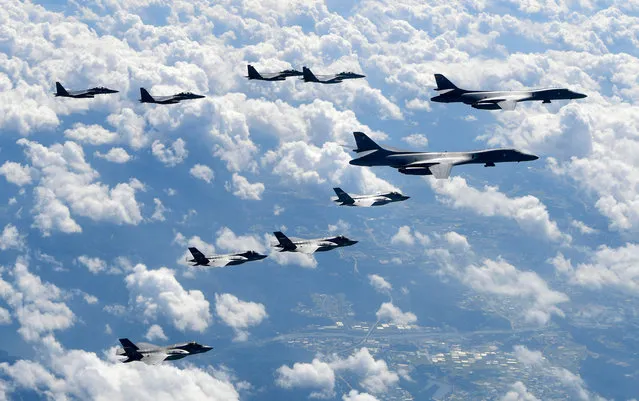 In this September 18, 2017, file photo provided by South Korea Defense Ministry, U.S. Air Force B-1B bombers, F-35B stealth fighter jets and South Korean F-15K fighter jets fly over the Korean Peninsula during joint drills. Ahead of the second summit between U.S. President Donald Trump and North Korean leader Kim Jong Un, some observers say there is an uncertainty over the future of the decades-long military alliance between Washington and Seoul. (Photo by South Korea Defense Ministry via AP Photo)