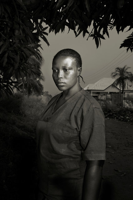 Professional portraiture category winner. Ebola Survivors, by Marcello Bonfanti, Italy. Monjama Moussa, 25, is a married mother of four children, from Goderich, Sierra Leone. After being treated for ebola by the Italian NGO Emergency, she returned home, but was refused by her family, who considered her healing as a sign of demon possession. She has lost her family and her job. She now works as cleaner at the emergency surgical hospital in Goderich. (Photo by Marcello Bonfanti)