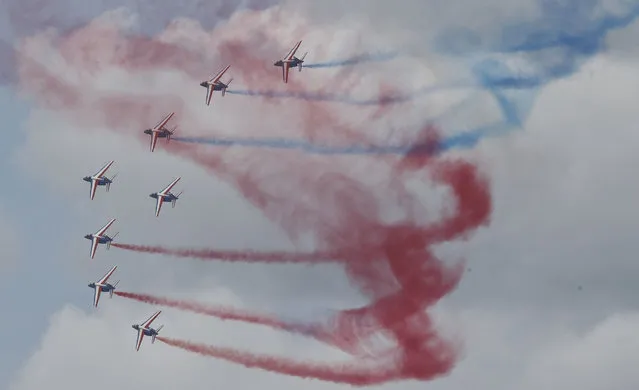 The Alpha Jets of the Patrouille de France acrobatic team perform their demonstration flight during the closing day of the Paris Air Show in Le Bourget, north of Paris, Sunday,  June 21, 2015. Some 300,000 aviation professionals and spectators are expected at this week's Paris Air Show, coming from around the world to make business deals and see dramatic displays of aeronautic prowess and the latest air and space technology. (AP Photo/Michel Euler)