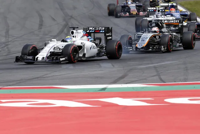 Williams driver Felipe Massa, left, of Brazil steers his car during the the Formula One Grand Prix race, at the Red Bull Ring in Spielberg, southern Austria, Sunday, June 21, 2015. (AP Photo/Darko Bandic)