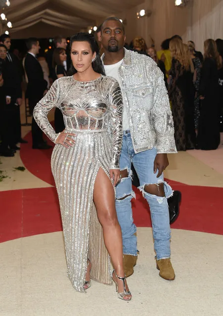 Kim Kardashian, left, and Kanye West arrive at The Metropolitan Museum of Art Costume Institute Benefit Gala, celebrating the opening of “Manus x Machina: Fashion in an Age of Technology” on Monday, May 2, 2016, in New York. (Photo by Evan Agostini/Invision/AP Photo)